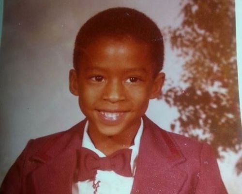 Antwon Tanner's childhood picture with a red coat and a bow tie